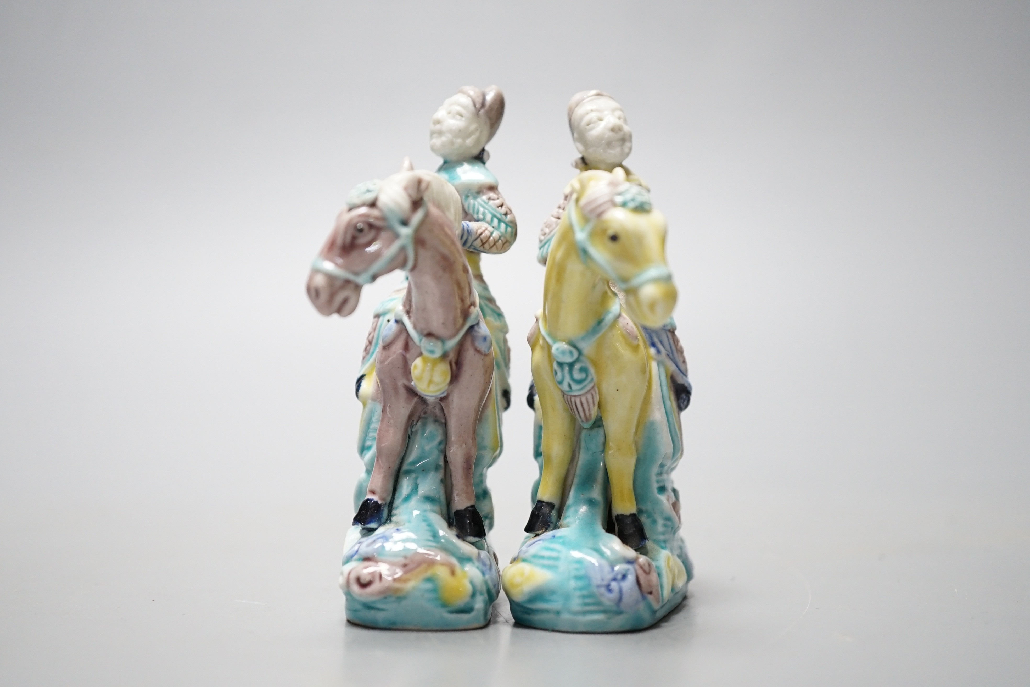 A pair of early 20th century Chinese equestrian groups, 9cm tall